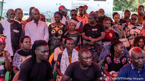 Relatives receive bodies of victims who willfully starved to death as part of a religious cult