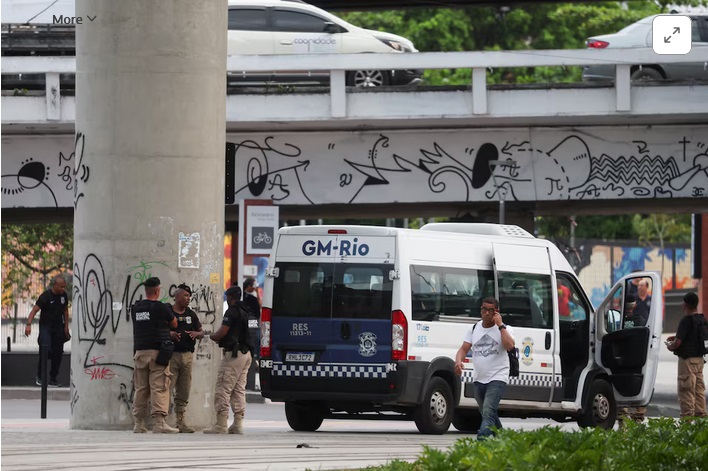 Police in Brazil arrested a man on Tuesday after he hijacked a bus and shot two people at a bus station in Rio de Janeiro before holding 17 people hostage for about three hours.