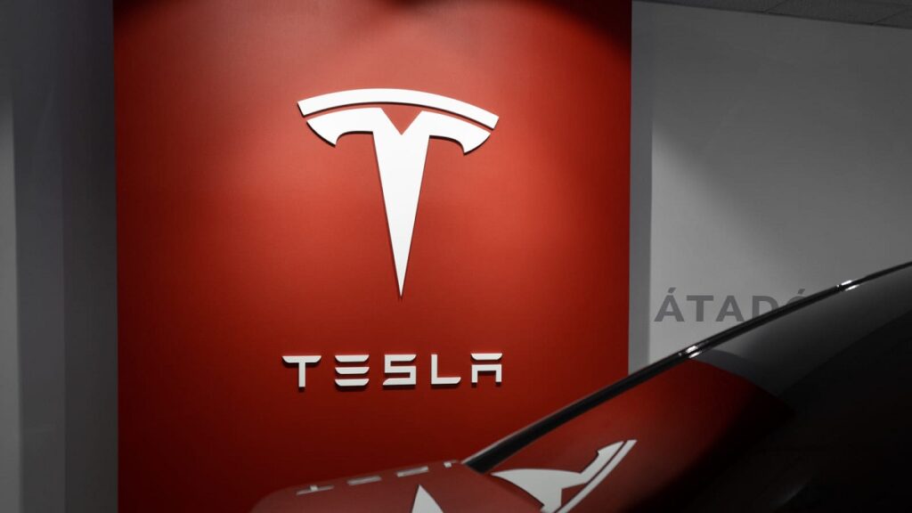 Tesla said it expects to achieve slight growth in vehicle deliveries this year, reporting a higher-than-expected profit margin.