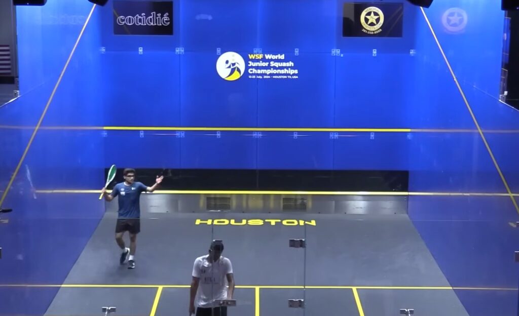 Defending champion Hamza Khan was defeated by Korea's Joo Ying-Na at the World Junior Squash Championship in Houston, United States on Monday.