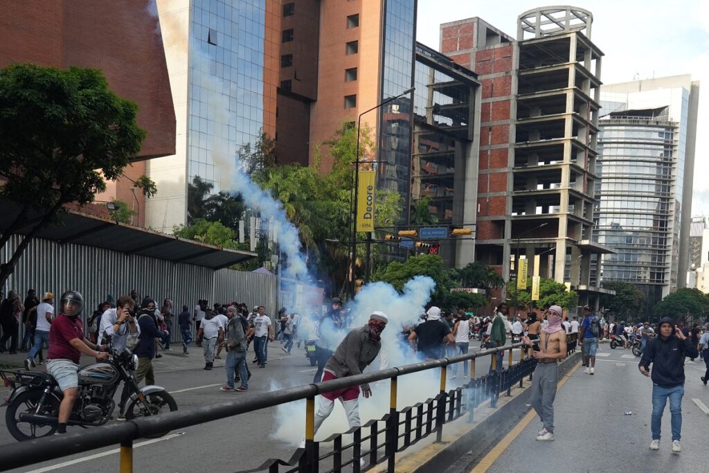 Protesters took to streets throughout Venezuela on Tuesday, waving flags and demanding President Nicolas Maduro acknowledge he lost Sunday's election to an opposition that says they clinched a landslide victory.