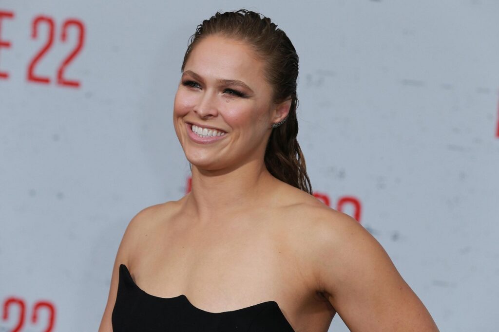 Ronda Rousey discussed her experiences in WWE, contrasting her time under Vince McMahon with the current leadership of Triple H.