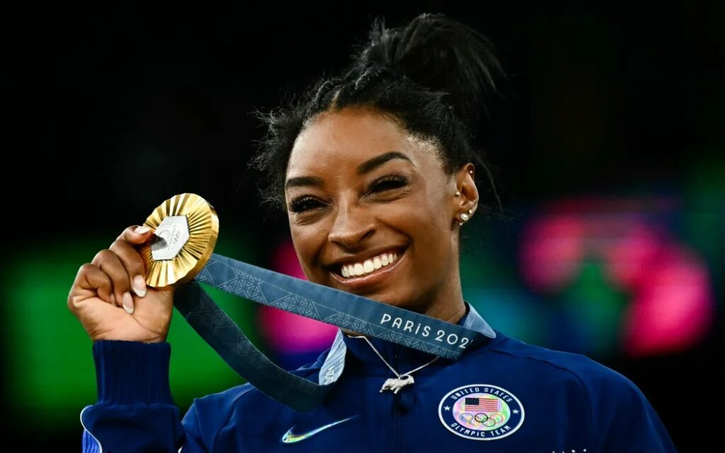 : Simone Biles clinched her sixth Olympic gold medal in front of an ecstatic crowd at the Paris Games on Thursday,