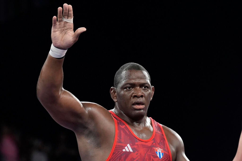 Cuban wrestling great Mijain Lopez became the first Olympian to win five golds in the same individual event on Tuesday