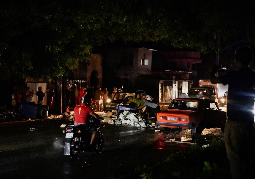 Just three or four city blocks in all of Central Havana remained without electricity on Monday evening - an island of darkness in the Cuban capital's sea of flashing lights, pounding reggaeton and jammed bars and cafes.