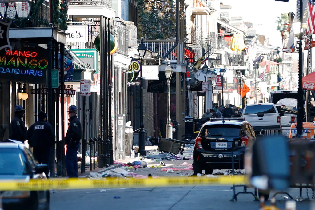 A Texas man crashed a pickup truck into a crowd celebrating New Year's Day in New Orleans' French Quarter and then opened fire on police