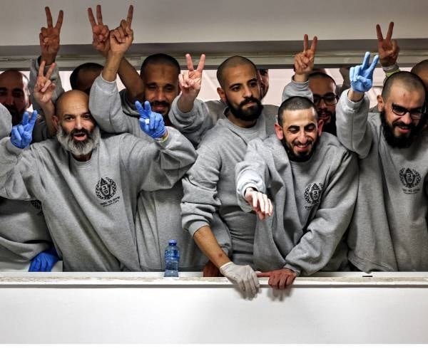 Thousands of Palestinians welcomed prisoners freed under a ceasefire deal between Hamas and Israel that saw four Israeli hostages also return