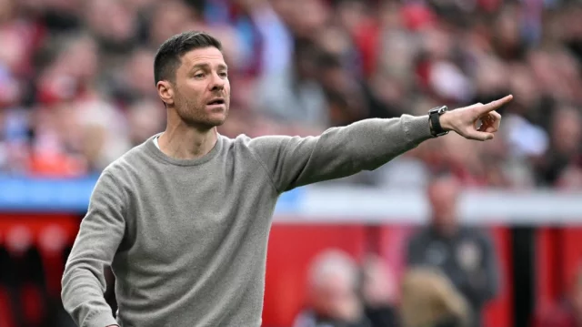 Xabi Alonso, Bayer Leverkusen's coach, would not concede the title after a 0-0 draw with Bayern Munich, leaving them eight points behind.