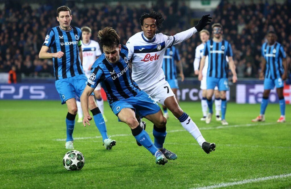 A penalty by substitute Gustaf Nilsson secured Club Brugge a 2-1 home win against Atalanta in Champions League knockout phase playoff