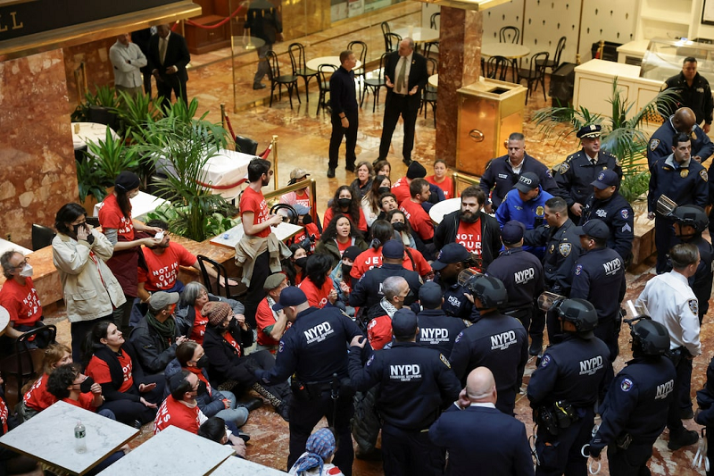 Scores of protesters poured into the lobby of Trump Tower to protest the arrest and detention of Columbia University student Mahmoud Khalil.