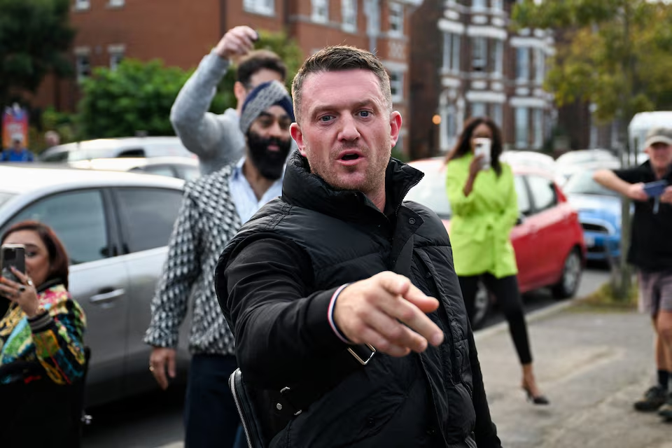 A member of the Irish rap band Kneecap was charged with a terrorism offence for displaying a flag in support of the Hezbollah.