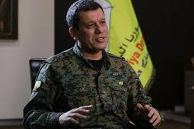 The commander of Kurdish forces that control northeast Syria said that his group is in direct contact with Turkey and open to improving ties