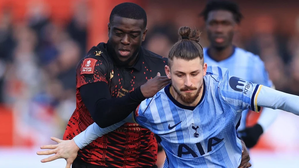 A fan who racially abused former Tamworth striker Chris Wreh after the its defeat to Tottenham Hotspur has been banned from attending matches