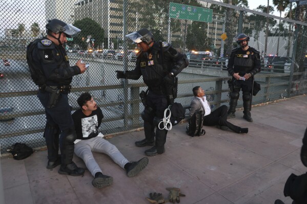 Los Angeles Mayor lifted a curfew imposed on part of the city's downtown to curb crime in the wake of raids on undocumented migrants.