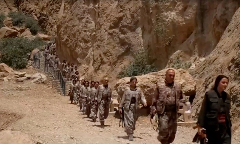 Kurdish PKK fighters destroy weapons at key ceremony