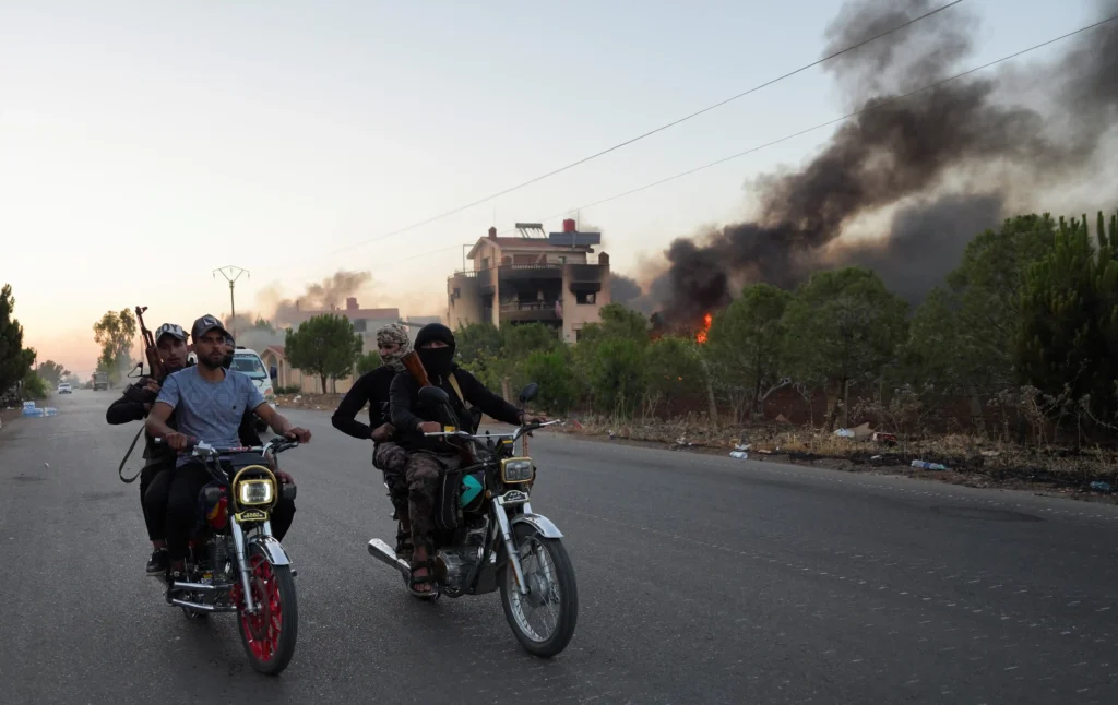 Sectarian clashes escalated in Syria's predominantly Druze region of Sweida on Saturday, with machinegun fire and mortar shelling ringing out after days of bloodshed as the Islamist-led government struggled to implement a ceasefire.