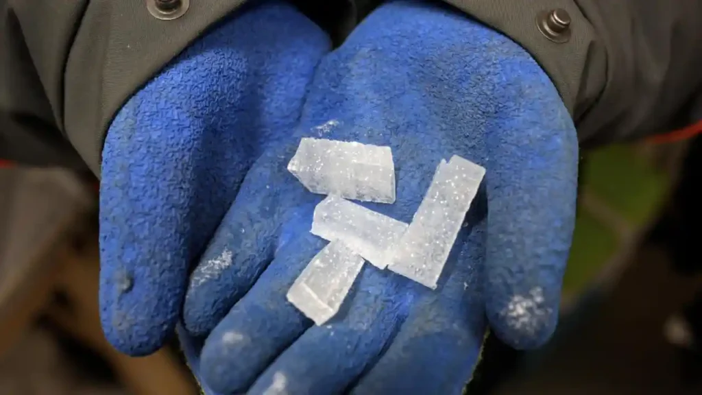 In a small, refrigerated room, scientists chop up Antarctic ice cores thousands of years old in search of clues for Earth's changing climate.