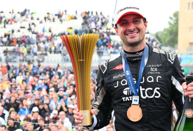 Jaguar's Mitch Evans won the first of two Formula E races in Berlin as Oliver Rowland had to put title celebrations on hold for another day.