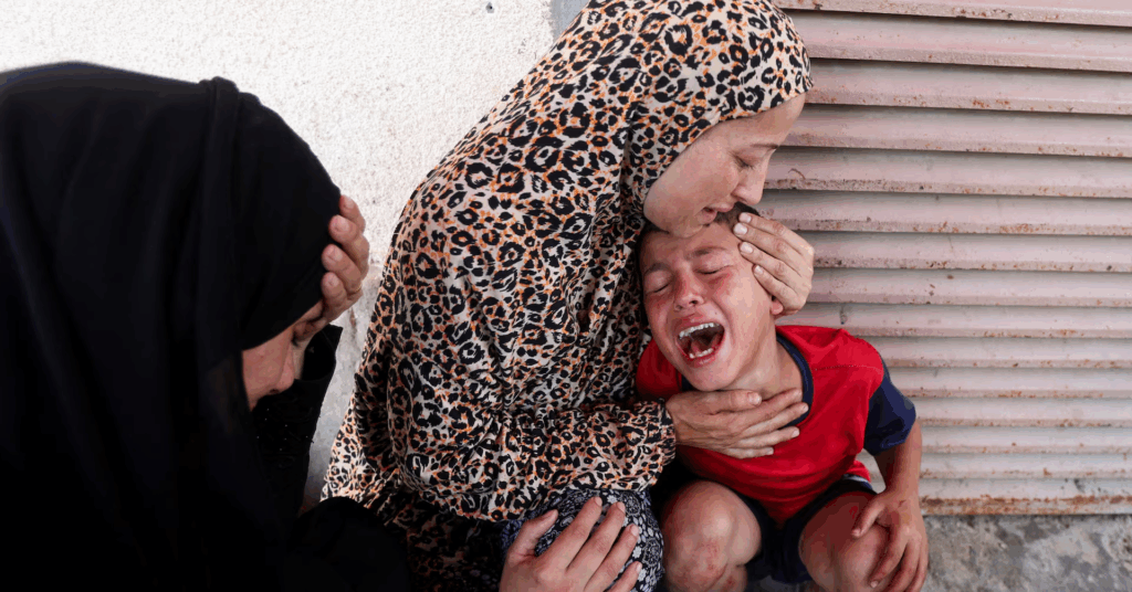 An Israeli airstrike hit Palestinians near a medical centre in Gaza, killing 10 children and six adults, as ceasefire talks dragged on.