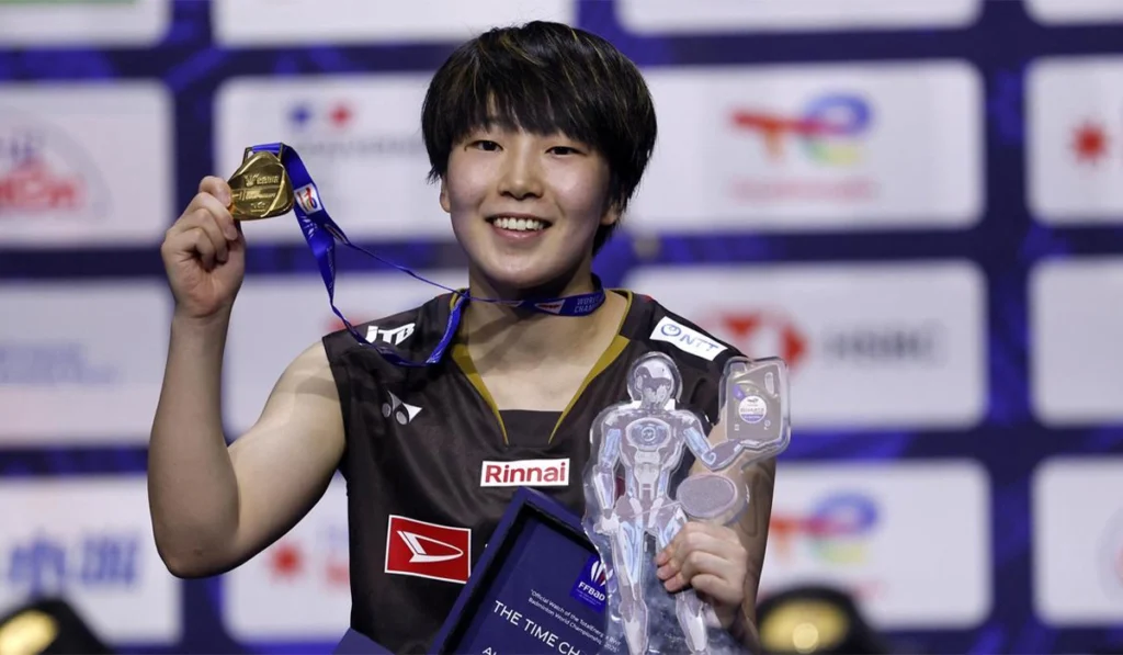 Yamaguchi beats ex-number one to clinch third badminton world title