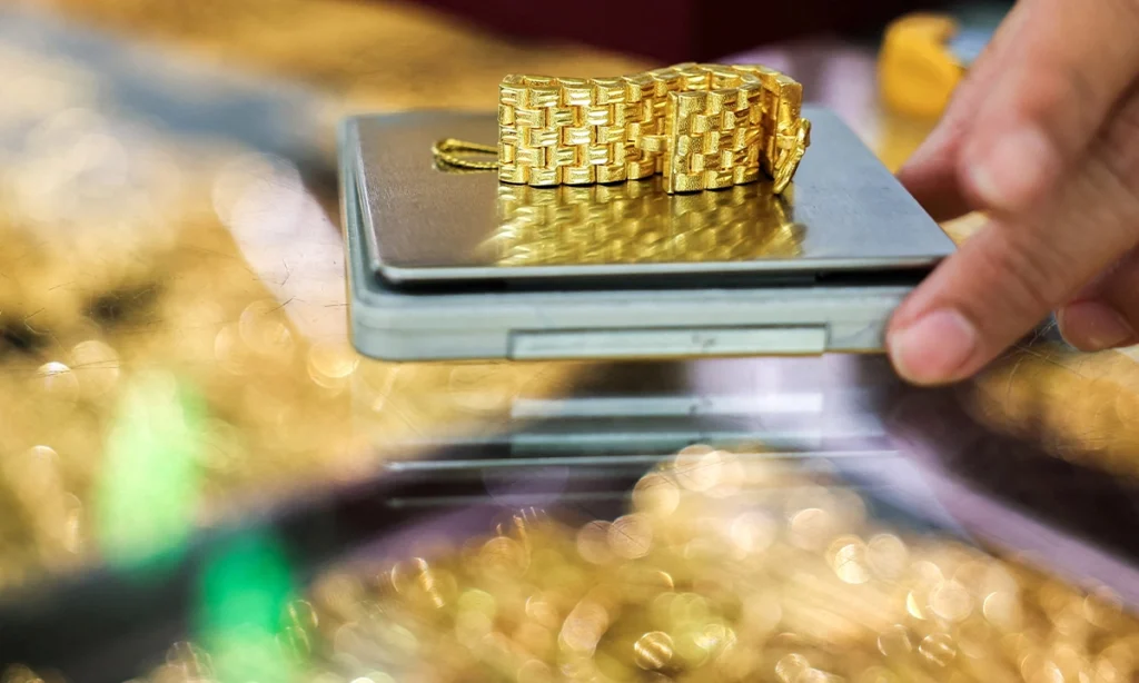 Gold, silver shatter records as investors rush to metals for safety