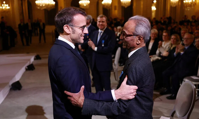 French President Emmanuel Macron awards Ali Akbar
