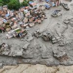 A drone view shows mud covering properties following a flash flood in Trishuli, Nuwakot district, Nepal