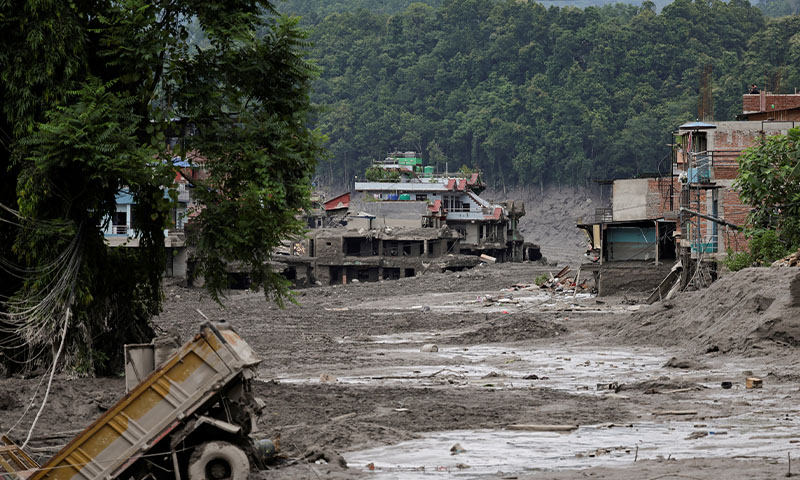 Mud covers houses and a road following a flash flood at Trishuli in Nuwakot district, Nepal, August 26, 2026. Photo Via Reuters