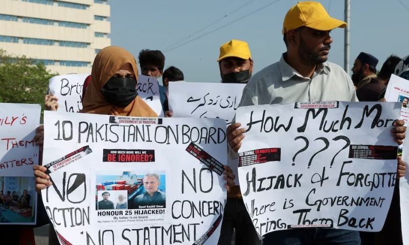 Families of the Pakistani hostage crew members of the Oil Products Tanker the HONOUR 25 that was hijacked by pirates off the coast of Somalia, hold placards during a protest, calling the government to take immediate action for the safe return of their loved ones, in Karachi, Pakistan May 13, 2026.